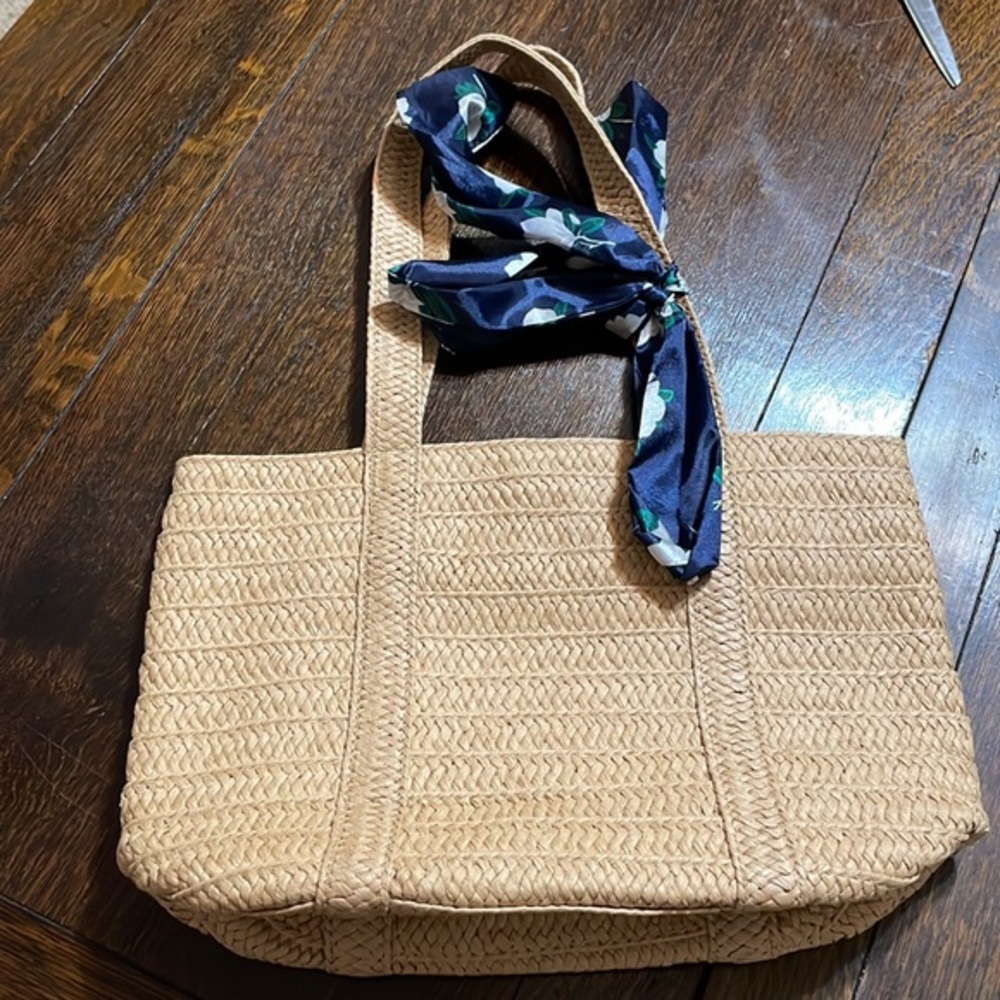 Draper James straw bag with a blue floral tie